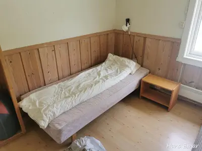 a small bed in a room with a table at Hemsedal - 7 bedrooms - WI-FI in Hemsedal
