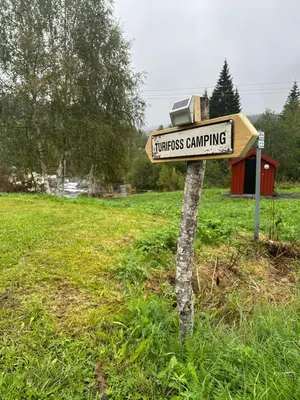 a sign for homeless camping in a field at Turifoss Camping Tent pitch in Svedjan