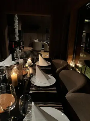a table with plates and napkins on it at a restaurant at Varden in Sør-Fron