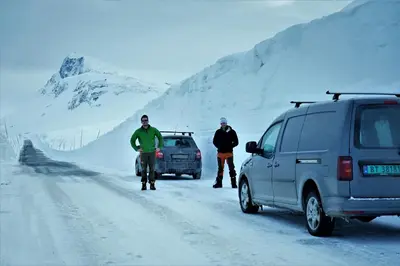two people standing on the side of a snow covered road at Immaculate Cabin in the Heart of Beitostølen in Beitostøl
