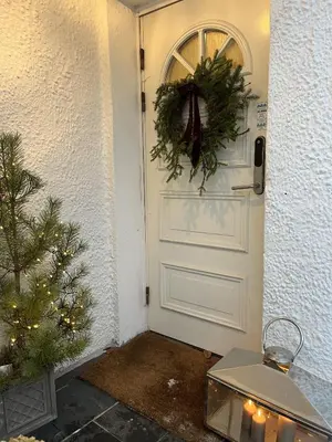 a white door with a wreath and a christmas tree at Large single-family home on Dalgård with walking distance to VM2025 in Trondheim