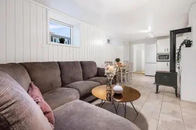 a living room with a couch and a table at Apartment in Lillehammer in Lillehammer