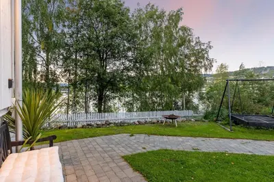 a backyard with a swing and a playground at Apartment in Lillehammer in Lillehammer