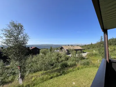 a view from the window of a house at Family-Friendly Stay With Stunning Mountain Views! in Beitostøl
