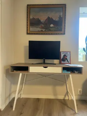 a desk with a television on top of it at Trollstova in Sogndal