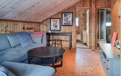 a living room with a couch and a table at Gorgeous Home In Vang I Valdres in Vang I Valdres
