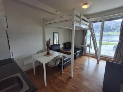 a room with a desk and a loft bed at Leilighet på Oppheim, Voss in Vossevangen