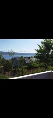 a view of a house with a view of the ocean at Holiday house by Lake Mjosa, 4 beds in Eidsvoll