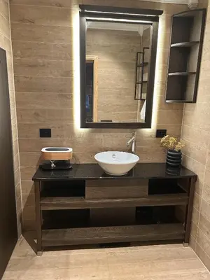 a bathroom with a sink and a mirror at Cabin by the fjord in Geiranger