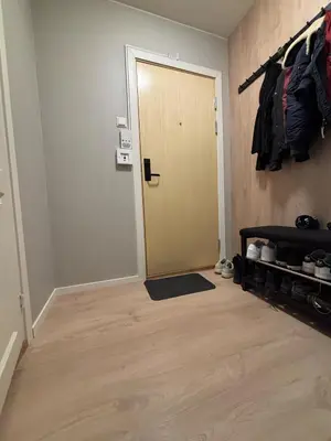 a hallway with a door and a rug in a room at Ski VM 2025 in Trondheim