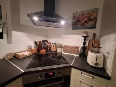 a kitchen with a stove and a counter top at Close to the Airport and Trondheim in Malvik