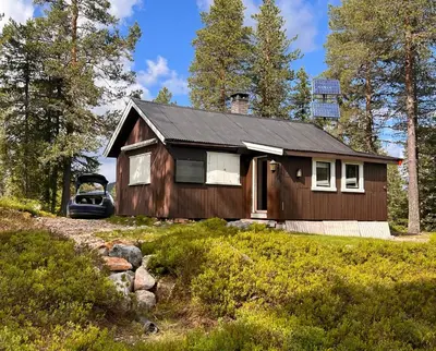 a house with a car parked in front of it at Veslekoia - Grandmas Cabin in Øksna