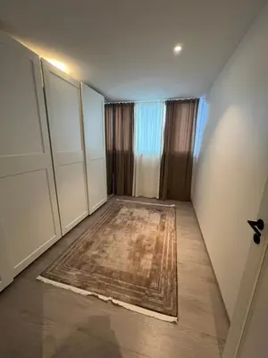 an empty room with a rug on the floor at Leilighet i trondheim in Trondheim