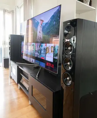 a entertainment center with a flat screen tv and speakers at Spacious house, close to Granåsen Ski Arena! 4 beds, 2 bathrooms, free parking in Trondheim