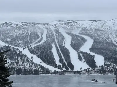 a ski resort in the middle of a snow covered mountain at Charming Cabin Near Hallingskarvet Ski Center, Cozy and Inviting! in Skoro