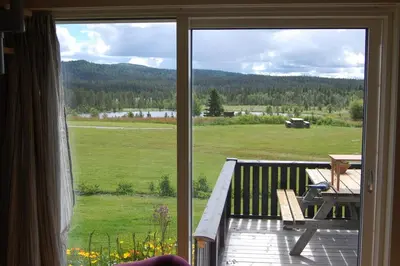 a sliding glass door of a porch with a picnic table at Apartment on Golsfjellet! in Gol