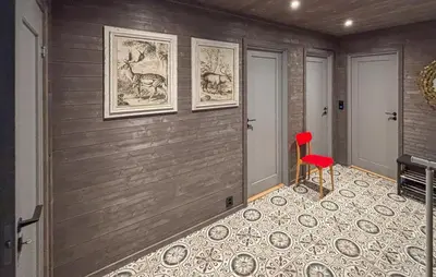 a room with a red chair and a wall at 3 Bedroom Cozy Home In Rendalen in Rendalen