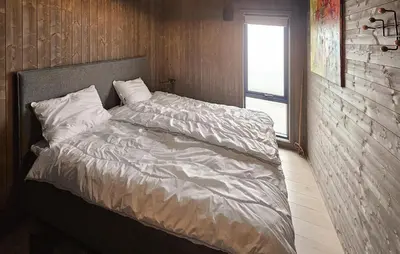 a large bed in a room with a window at 3 Bedroom Cozy Home In Rendalen in Rendalen