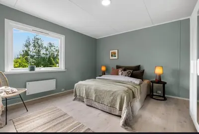 a bedroom with a bed and a window at Cozy Apartment in Lillehammer in Lillehammer