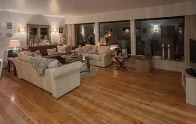 a living room with white furniture and wood floors at 4 Bedroom Gorgeous Home In Atløy in Herland