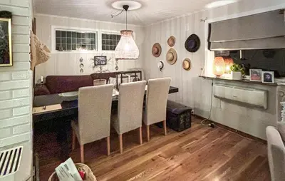 a kitchen and dining room with a table and chairs at 4 Bedroom Gorgeous Home In Atløy in Herland