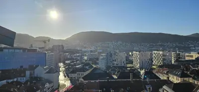 a view of a city with buildings and mountains at Best view in town in Bergen