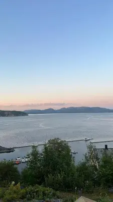 a view of a large body of water with boats at Kystperle med utsikt, lei en båt in Namsos