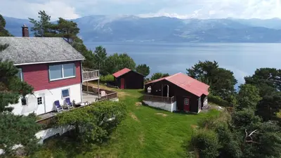 an aerial view of a house and a barn at Hardangerfjord panorama 2 in Kvam