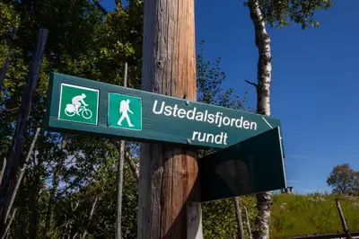 a green street sign on a wooden pole at Exclusive and cozy apartment central Geilo area in Geilo