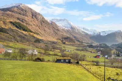 a view of a valley with snow covered mountains at Gildeskaal - A Fairytale Stay in Rosendal in Rosendal