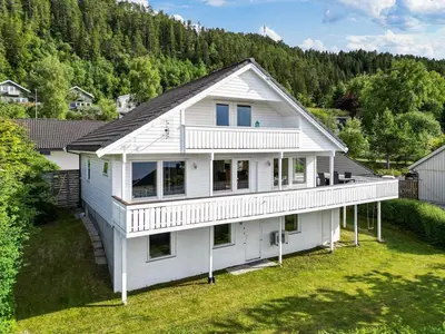 an aerial view of a white house at Appartment with garden in Malvik