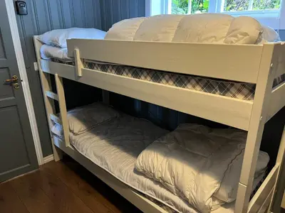 a couple of bunk beds in a room at Skiidyll Med Utsikt Og Peis in Beitostøl