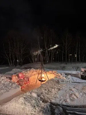 a camera in a pile of snow at night at Ustedalen Lodge in Geilo