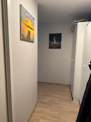 a room with two paintings on a wall at Near Granåsen in Trondheim