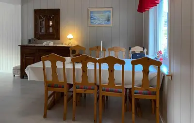 a dining room table and chairs with a white table and a table and a table at Gorgeous Home In Åheim in Åheim