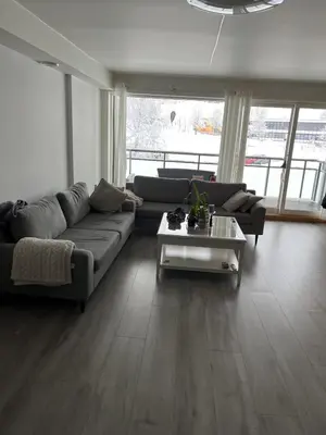 a living room with a couch and a coffee table at Trondheim in Trondheim