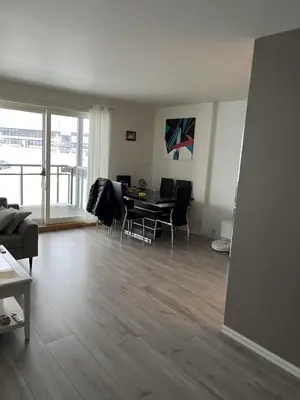 a living room with a table and chairs in it at Trondheim in Trondheim