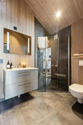 a bathroom with a shower and a sink and a toilet at Premium Cabin By Kvitfjell Ski Slopes in Ringebu