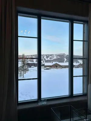 a window with a view of a snow covered field at Premium Cabin By Kvitfjell Ski Slopes in Ringebu
