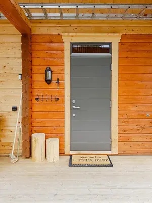 a garage door in the front of a wooden house at Charming Small Cabin At The Top Of Blefjell in Flesberg