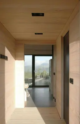 a view from the hallway of a house with wooden walls at Cabin Overlooking Hallingskarvet National Park in Geilo