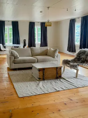 a living room with a couch and a coffee table at Historic Old Rectory In The Heart Of Norway in Vestre Gausdal