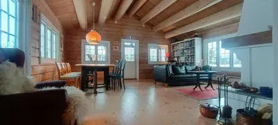 a living room with a couch and a table at Cabin With Sauna In Vegglifjell in Veggli