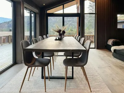 a dining room with a table and chairs at Stylish Cabin In Scenic Stryn in Stryn