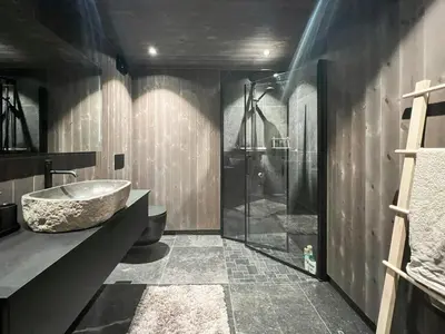 a bathroom with a tub and a sink and a shower at Stylish Cabin In Scenic Stryn in Stryn