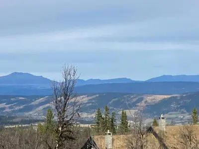 a view of a valley with mountains in the distance at Ålhytte Near Vasetvannet in Ron