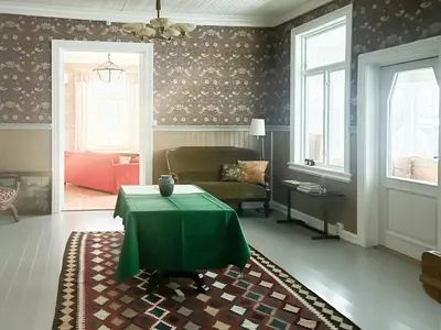 a living room with a green table and a couch at Historic Property In Idyllic Snertingdal in Segard