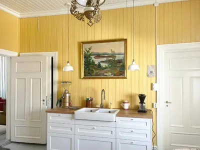 a kitchen with a sink and a painting on the wall at Historic Property In Idyllic Snertingdal in Segard