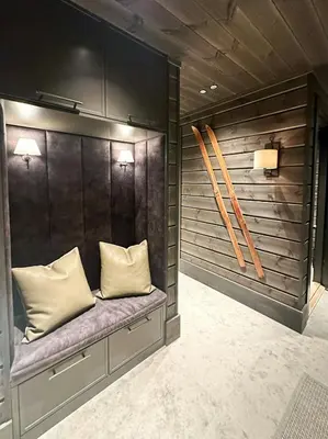 a room with a bench with two pillows at Unique Cabin With Spa And Ski In-Ski Out in Hemsedal