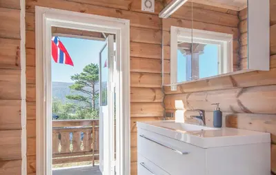 a kitchen with a sink and a window with a flag at Amazing Home In Lesjaskog With Wifi in Bjorli